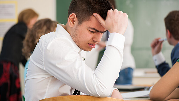 A boy at school in distress.