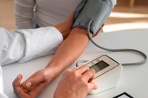 Picture of blood pressure being taken 