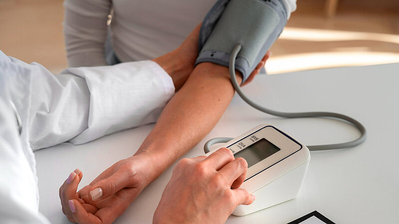 Picture of blood pressure being taken 
